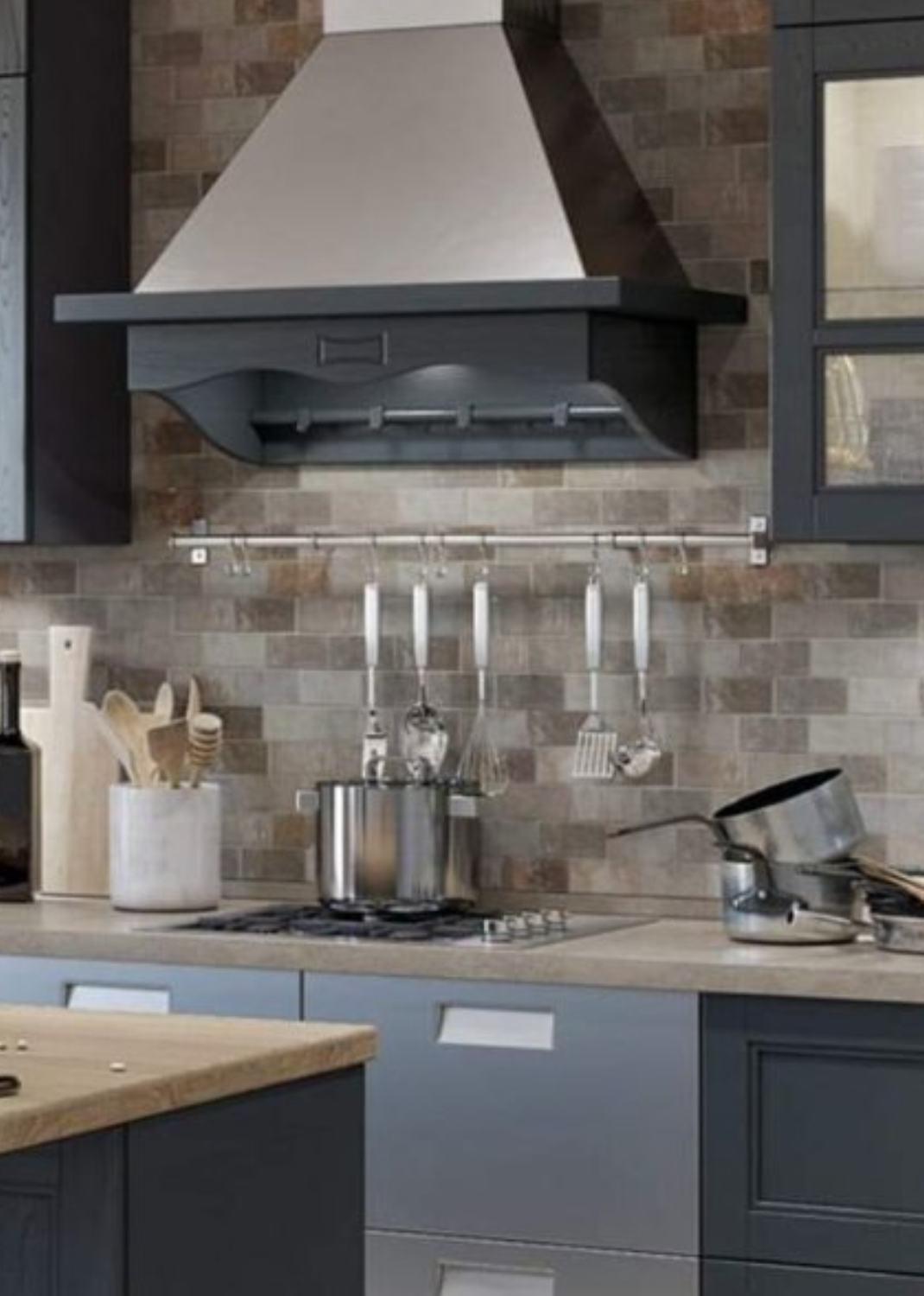 Finished navy kitchen with hood and tile backsplash
