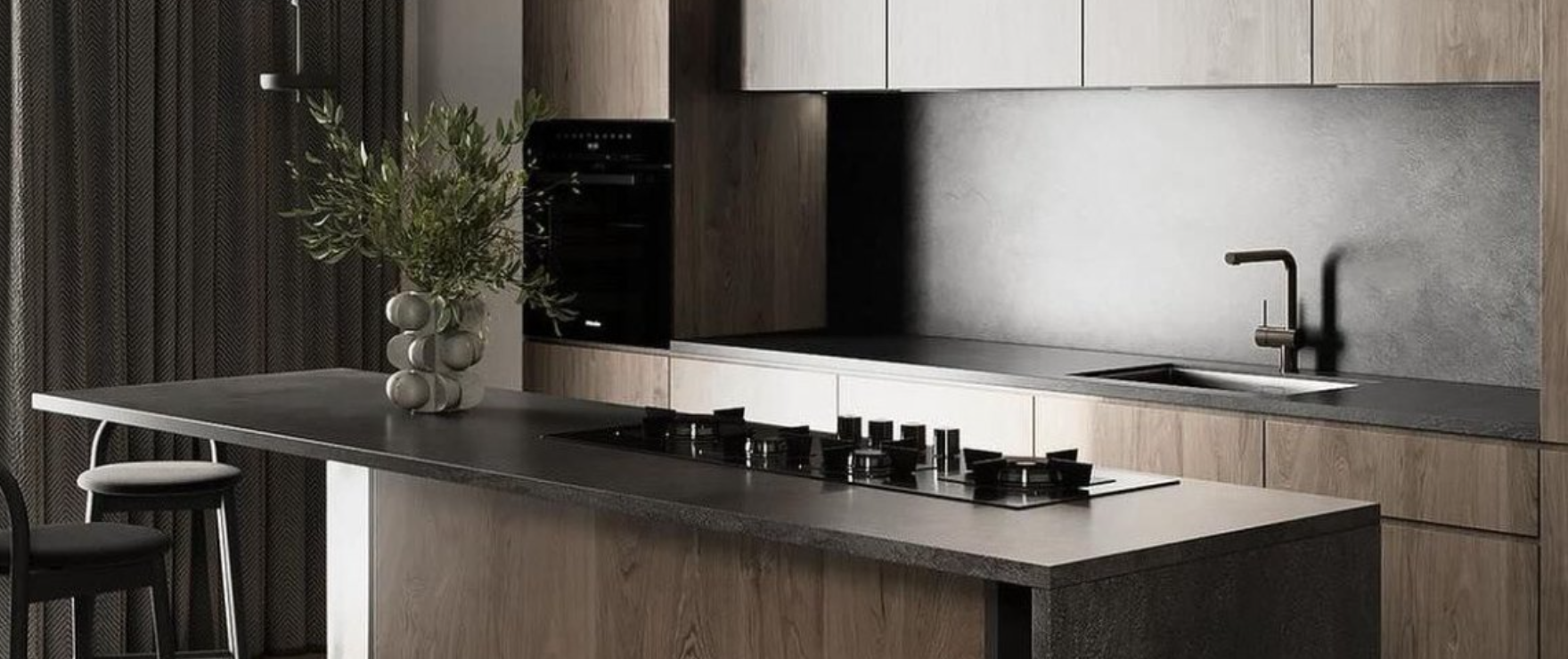Modern kitchen with dark island and wood cabinetry