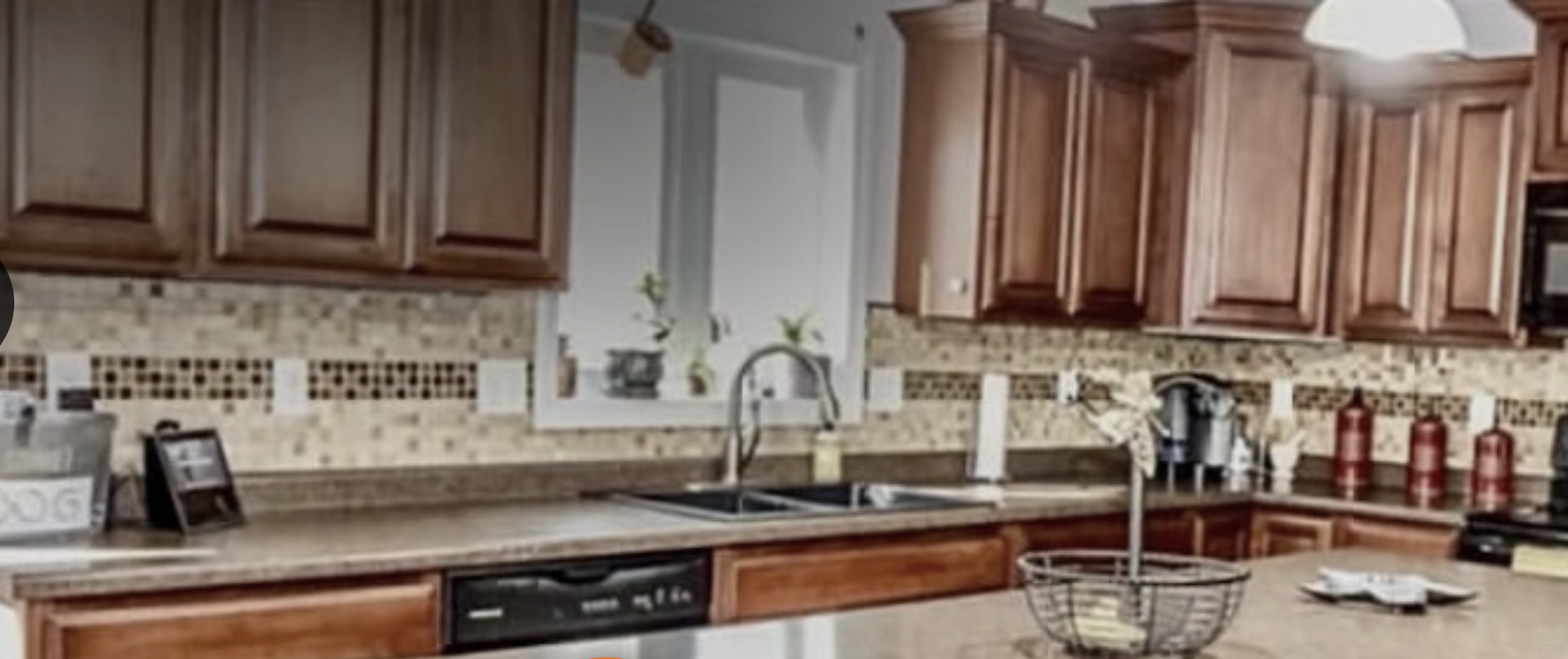 Kitchen with dated cabinets before remodel